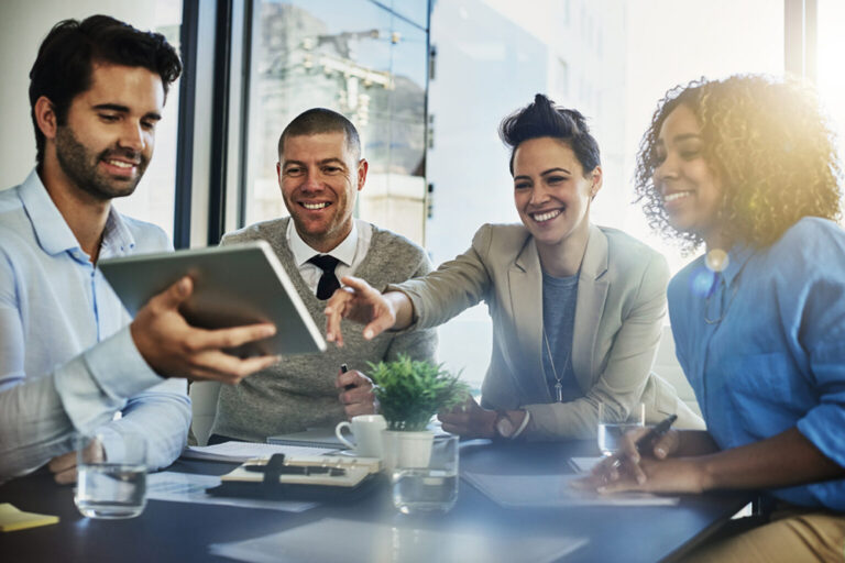 A group of colleagues meeting around a table
