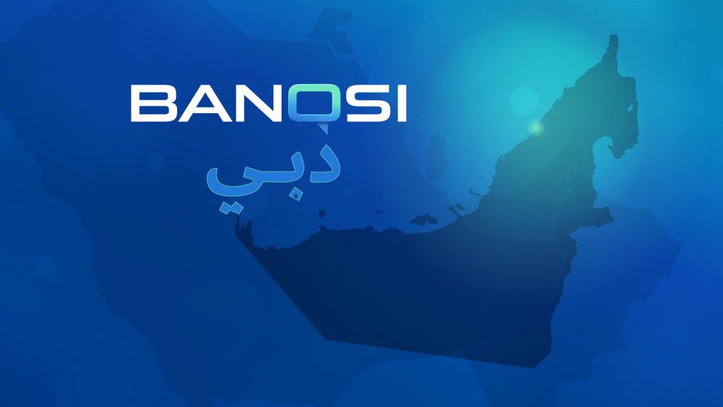 This graphic shows the shape of the United Arab Emirates with a glowing green spot in the location of Dubai. The BanQsi logo is shown as well as the word Dubai in Arabic.