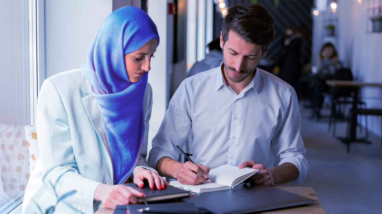 Two people working together